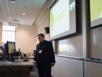 Matthew Golden, graduate student researcher in the School of Physics, presents at a recent machine learning conference at Georgia Tech. (Photo Benjamin Zhao)