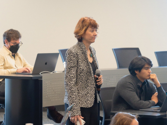 School of Physics Professor Tamara Bogdanovic prepares to ask a question at the recent machine learning conference at Georgia Tech. (Photo Benjamin Zhao)